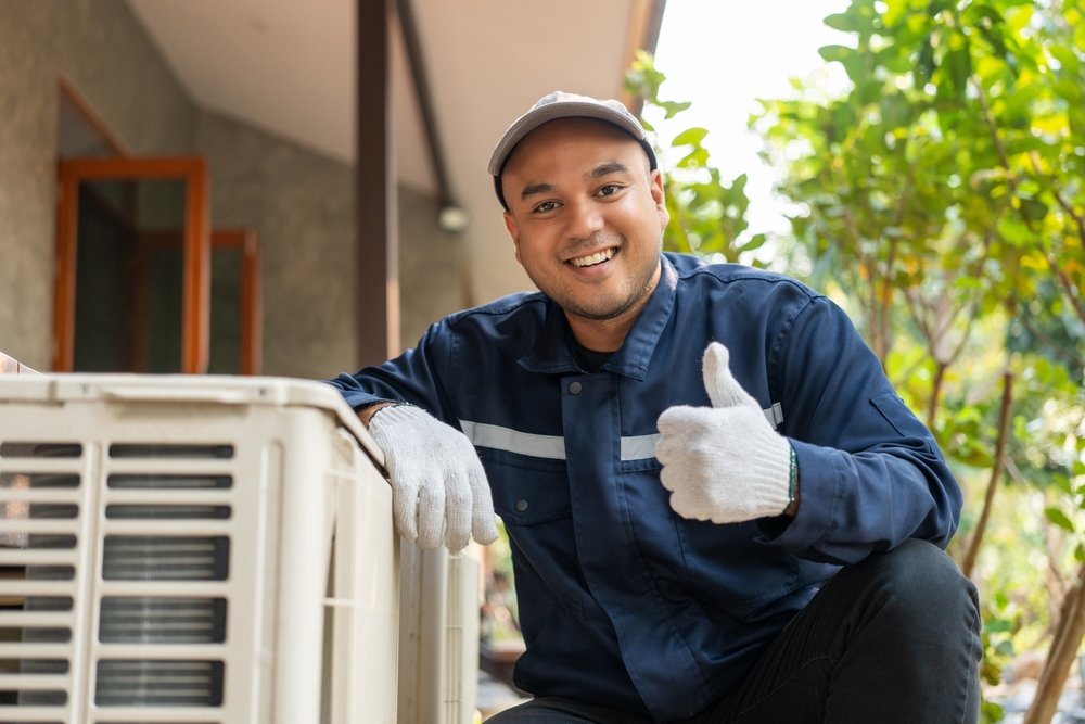 Duckworks HVAC technician servicing an air conditioner in Phoenix